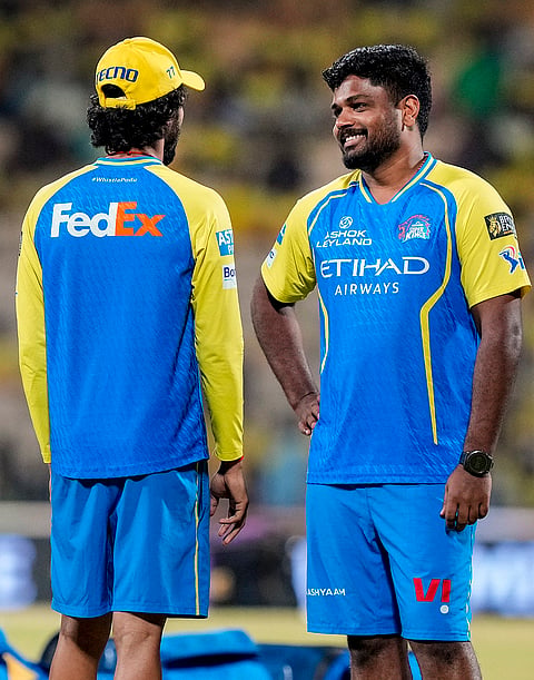 Chennai Super Kings' Sanju Samson, right, during a warm-up before the Indian Premier League (IPL) 2026 T20 cricket match between Chennai Super Kings and Kolkata Knight Riders, at MA Chidambaram Stadium in Chennai, Tamil Nadu.