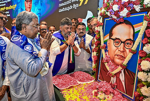Karnataka Chief Minister Siddaramaiah and Deputy Chief Minister DK Shivakumar pay tributes during celebrations marking the birth anniversary of BR Ambedkar at Bharat Jodo Bhavan, in Bengaluru. 