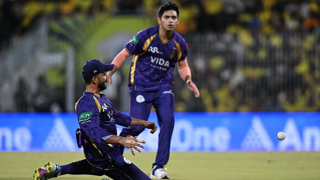 Ajinkya Rahane, left, misfields the ball during the Indian Premier League match between Chennai Super Kings and Kolkata Knight Riders in Chennai. - AP