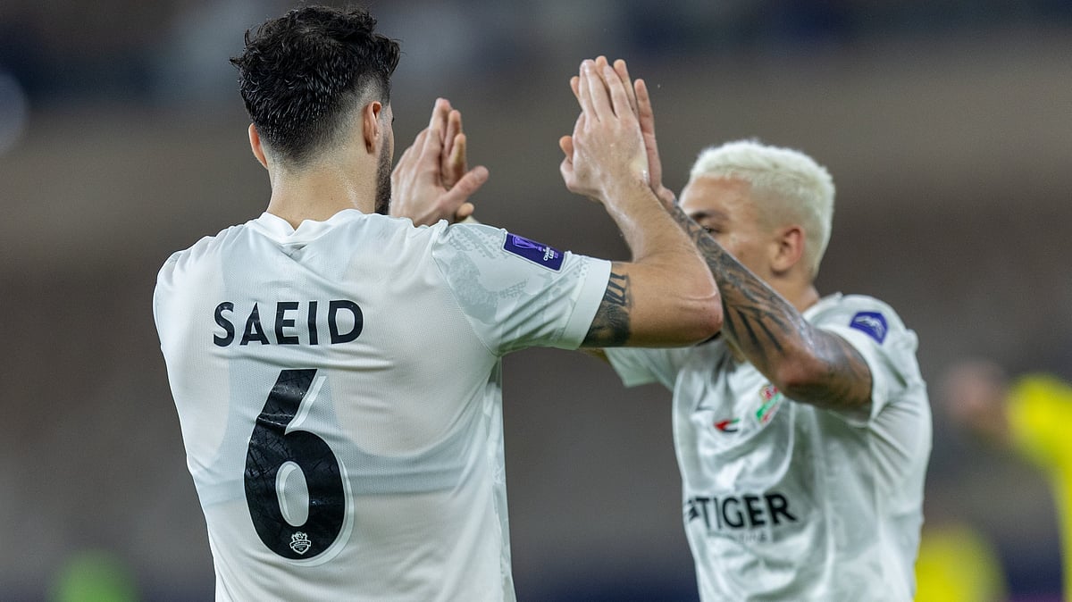 Shabab Al-Ahli's Saeid Ezatolahi celebrates with his teammate after scoring during the AFC Champions League Elite round of 16 match against Tractor FC on April 14, 2026. - | Photo: X/Shabab_AlAhliFC