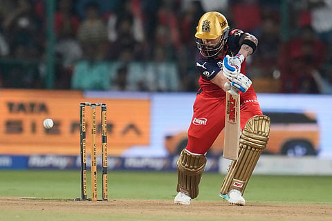 Royal Challengers Bengaluru's Virat Kohli plays a shot during the Indian Premier League cricket match between Royal Challengers Bengaluru and Lucknow Super Giants in Bengaluru, India.