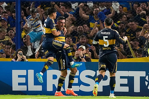 Lautaro Di Lollo of Argentina's Boca Juniors, second from left, celebrates scoring his side's opening goal against Ecuador's Barcelona during a Copa Libertadores Group D soccer match in Buenos Aires, Argentina.