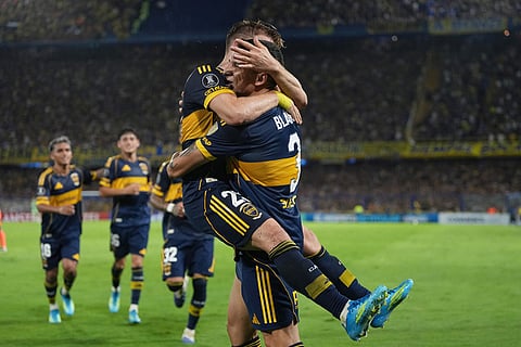 Santiago Ascacibar of Argentina's Boca Juniors celebrates with teammate Lautaro Blanco, right, after scoring his side's second goal Ecuador's Barcelona during a Copa Libertadores Group D soccer match in Buenos Aires, Argentina, Tuesday, April 14, 2026. (