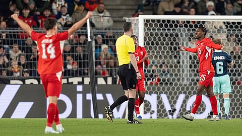 Switzerland's Joel Monteiro, right, celebrates his goal after scoring the third goal for Switzerland during an international friendly soccer match between Switzerland and Germany in Basel, Switzerland.