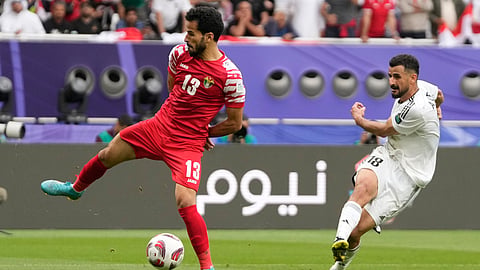 Iraq's Aymen Hussein, right, scores his side's second goal during the Asian Cup Round of 16 soccer match between Iraq and Jordan, at Khalifa International Stadium in Doha, Qatar, Monday, Jan. 29, 2024.