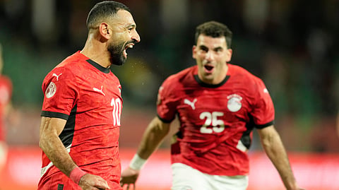 Egypt's Mohamed Salah celebrates after scoring his side's third goal during the Africa Cup of Nations round of 16 soccer match between Egypt and Benin in Agadir, Morocco, Monday, Jan. 5, 2026.