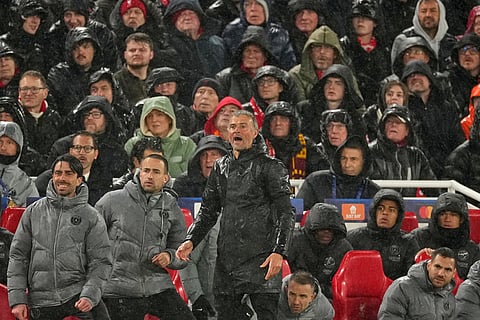 PSG's head coach Luis Enrique, center, reacts during the Champions League quarterfinal second leg soccer match between Liverpool and Paris Saint-Germain in Liverpool, England.