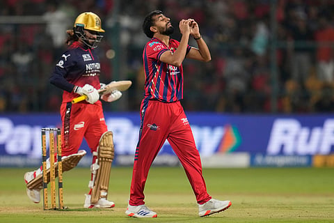 Lucknow Super Giants' Prince Yadav, right, celebrates the wicket of Royal Challengers Bengaluru's captain Rajat Patidar, left, during the Indian Premier League cricket match between Royal Challengers Bengaluru and Lucknow Super Giants in Bengaluru, India.