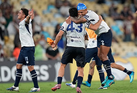 Players of Argentina's Independiente Rivadavia celebrate their team's 2-1 victory over Brazil's Fluminense at the end of a Copa Libertadores Group C soccer match in Rio de Janeiro.