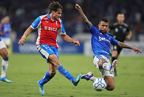 Clemente Montes of Chile's Universidad Catolica, left, and Matheus Henrique of Brazil's Cruzeiro battle for the ball during a Copa Libertadores Group D soccer match in Belo Horizonte, Brazil.
