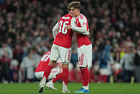 | Photo: AP/Kin Cheung : Arsenal's Martin Zubimendi, left, and Max Dowman hug afterthe UEFA Champions League second leg quarterfinal soccer match between Arsenal and Sporting in London, England.