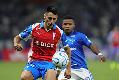 Juan Diaz of Chile's Universidad Catolica, left, and Keny Arroyo of Brazil's Cruzeiro battle for the ball during a Copa Libertadores Group D soccer match in Belo Horizonte, Brazil.