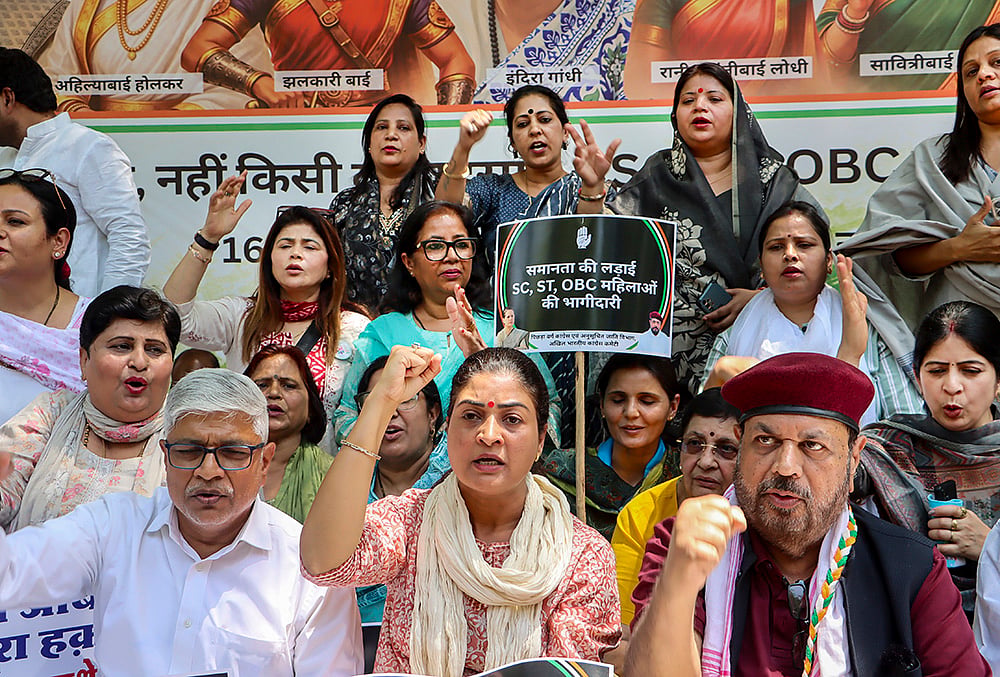 Congress leader Alka Lamba, front centre, and others stage a protest demanding SC/ST reservation in the 'Nari Shakti Vandan Adhiniyam', commonly known as the Women's Reservation Act, in New Delhi. A special three-day sitting of Parliament is being held from April 16 to 18, during which amendments to the Act, mandating 33 per cent reservation for women in Lok Sabha and state Assemblies, will be brought for implementation in 2029.  - | Photo: PTI