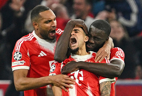 Bayern's Luis Diaz, center, celebrates with his teammates after scoring his side's third goal during the Champions League quarterfinal second leg soccer match between Bayern Munich and Real Madrid in Munich, Germany.