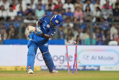Mumbai Indians' Shefane Rutherford bowled out by Punjab Kings' Arshdeep Singh during the Indian Premier League cricket match between Mumbai Indians and Punjab Kings in Mumbai.