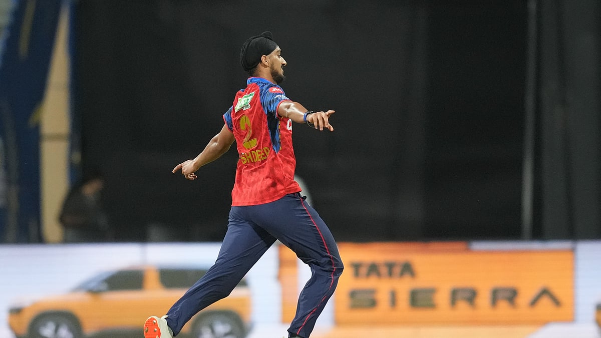Punjab Kings' Arshdeep Singh, left, celebrates the wicket of Mumbai Indians' Suryakumar Yadav during the Indian Premier League cricket match between Mumbai Indians and Punjab Kings in Mumbai, India, Thursday, April 16, 2026. - (AP Photo/Rafiq Maqbool)