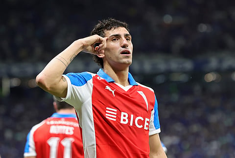 Justo Giani of Chile's Universidad Catolica celebrates after scoring his side's opening goal against Brazil's Cruzeiro during a Copa Libertadores group D soccer match in Belo Horizonte, Brazil.