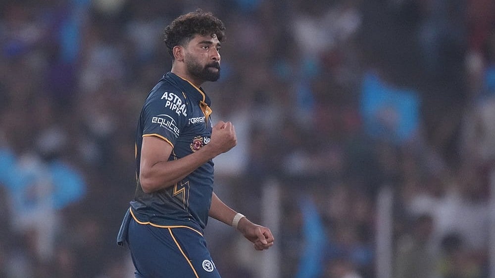 Gujarat Titans' Mohammed Siraj celebrates the wicket of Kolkata Knight Riders' Sunil Narine during the Indian Premier League cricket match between Gujarat Titans and Kolkata Knight Riders in Ahmedabad. - | Photo: AP/Ajit Solanki
