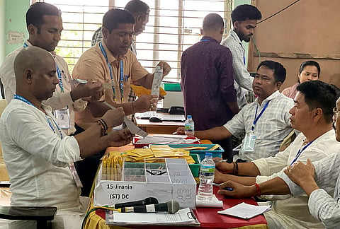Polling officials during the counting of votes in the Tripura Tribal Areas Autonomous District Council (TTAADC), in Agartala, Tripura.