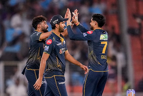 Gujarat Titans' Mohammed Siraj, left, celebrates with captain Shubman Gill during the Indian Premier League (IPL) 2026 T20 cricket match between Gujarat Titans and Kolkata Knight Riders, in Ahmedabad, Gujarat.