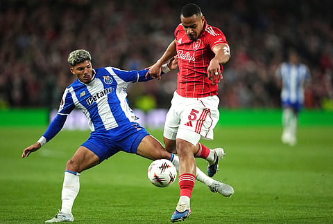 Nottingham Forest's Murillo, right, and Porto's Carvalho William in action during the Europa League quarterfinal second leg soccer match between Nottingham Forest and Porto in Nottingham, England.