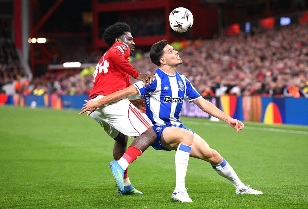 Nottingham Forest's Ola Aina, left, and Porto's Francisco Moura in action during the Europa League quarterfinal second leg soccer match between Nottingham Forest and Porto in Nottingham, England. - | Photo: Gary Oakley/PA via AP