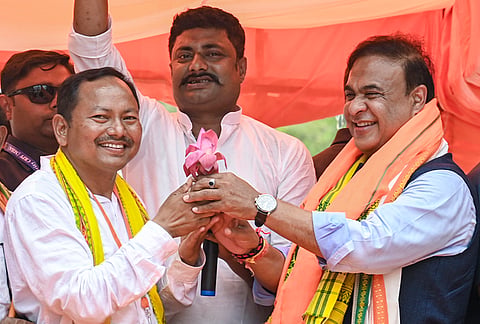 Assam Chief Minister Himanta Biswa Sarma, right, during an election campaign in support of BJP candidates ahead of the West Bengal Assembly Election, at Raiganj, in Uttar Dinajpur district.