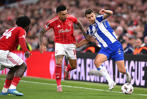 Porto's Jakub Kiwior, right, and Nottingham Forest's Igor Jesus in action during the Europa League quarterfinal second leg soccer match between Nottingham Forest and Porto in Nottingham, England.