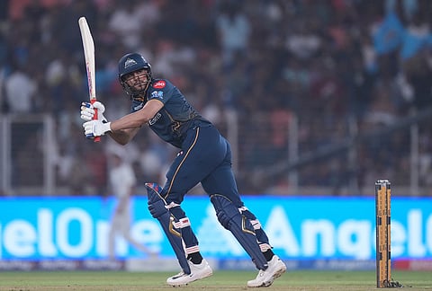 Gujarat Titans' captain Shubman Gill plays a shot during the Indian Premier League cricket match between Gujarat Titans and Kolkata Knight Riders in Ahmedabad.