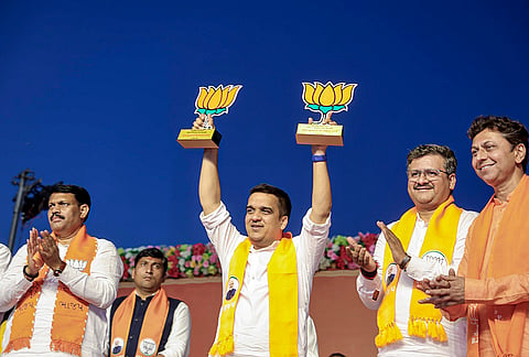 Gujarat Deputy Chief Minister Harsh Sanghavi, centre, with BJP members, during a public meeting, in Gujarat. 