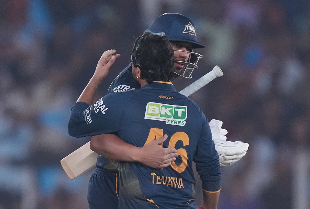 | Photo: AP/Ajit Solanki : Gujarat Titans' Shahrukh Khan and Rahul Tewatia celebrate the win over Kolkata Knight Riders during the Indian Premier League cricket match in Ahmedabad.
