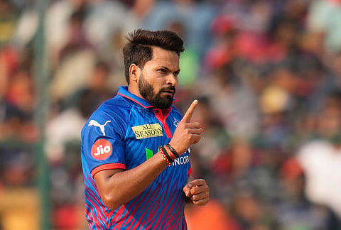 Delhi Capitals' Mukesh Kumar celebrates the dismissal of Royal Challengers Bengaluru's captain Rajat Patidar during the Indian Premier League cricket match between Royal Challengers Bengaluru and Delhi Capitals in Bengaluru.