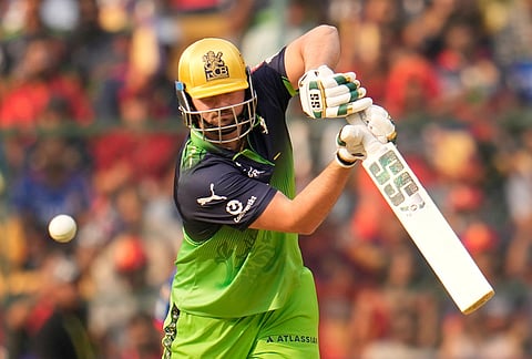 Royal Challengers Bengaluru's Tim David plays a shot during the Indian Premier League cricket match between Royal Challengers Bengaluru and Delhi Capitals in Bengaluru.