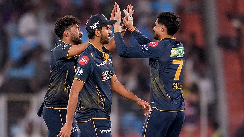 Gujarat Titans' Mohammed Siraj, left, celebrates with captain Shubman Gill during the Indian Premier League (IPL) 2026 T20 cricket match between Gujarat Titans and Kolkata Knight Riders, in Ahmedabad, Gujarat. - | Photo: PTI/Salman Ali