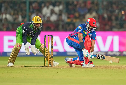Delhi Capitals' captain Axar Patel plays a shot during the Indian Premier League cricket match between Royal Challengers Bengaluru and Delhi Capitals in Bengaluru.