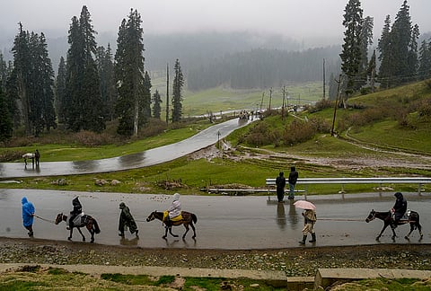 Tourists take mule rides on a foggy afternoon at Doodhpathri, in Budgam district, Jammu and Kashmir. Security has been beefed up around vulnerable installations, including prominent tourist destinations to ensure a safe and secure environment for visitors ahead of the Pahalgam terrorist attack anniversary. 