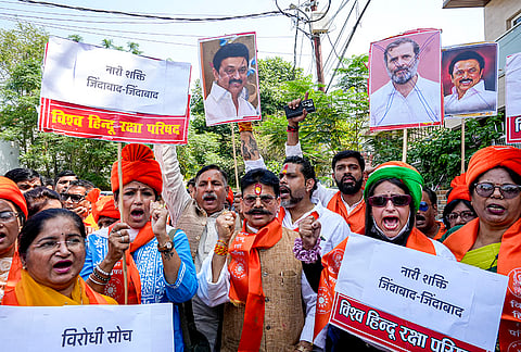 Vishwa Hindu Raksha Parishad chief Gopal Rai, centre, and others stage a protest condemning the opposition, a day after the Constitution Amendment Bill to implement reservation for women in legislatures in 2029 and increase the number of seats of the Lok Sabha was defeated, in Lucknow, Uttar Pradesh.