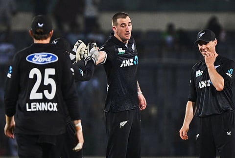New Zealand's Blair Tickner, centre, celebrates with teammates the wicket of Bangladesh's Taskin Ahmed during the first one day international cricket match between Bangladesh and New Zealand in Mirpur, Bangladesh.