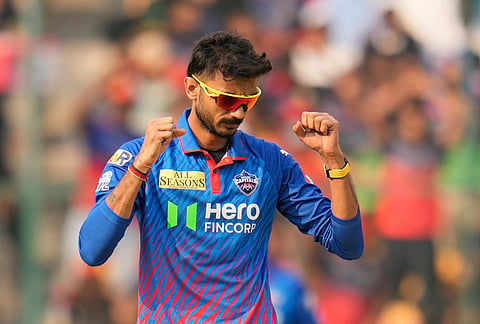 Delhi Capitals' captain Axar Patel celebrates the dismissal of Royal Challengers Bengaluru's Devdutt Padikkal during the Indian Premier League cricket match between Royal Challengers Bengaluru and Delhi Capitals in Bengaluru.