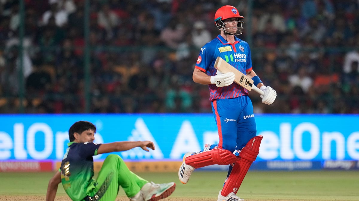 Delhi Capitals' Tristan Stubbs in action as Royal Challengers Bengaluru's Rasikh Salam watches during the IPL 2026 cricket match between Royal Challengers Bengaluru and Delhi Capitals in Bengaluru. - AP Photo