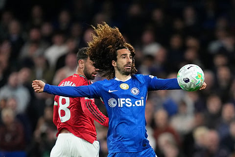 Chelsea's Marc Cucurella, front, and Manchester United's Bruno Fernandes challenge for the ball during the English Premier League soccer match between Chelsea and Manchester United in London.