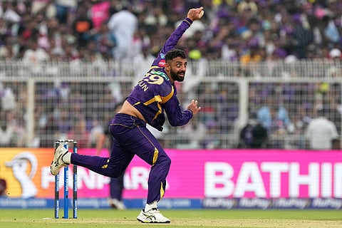Kolkata Knight Riders' Varun Chakaravarthy bowls a delivery during the Indian Premier League cricket match between Kolkata Knight Riders and Rajasthan Royals in Kolkata, India.