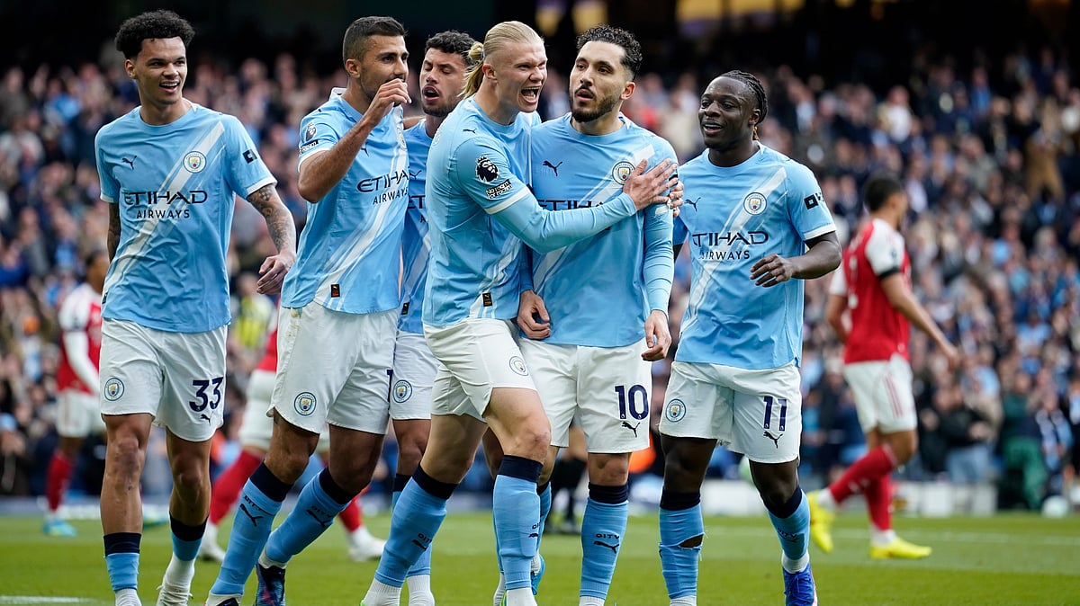 | Photo: AP/Dave Thompson : Manchester City's Rayan Cherki celebrates with his teammates after scoring his side's first goal during the English Premier League soccer match between Manchester City and and Arsenal, in Manchester, England, Sunday, April 19, 2026. 