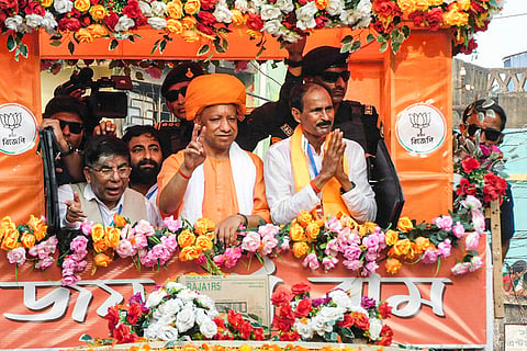 Bankura: Uttar Pradesh Chief Minister Yogi Adityanath takes part in a roadshow during a campaign in support of Bharatiya Janata Party (BJP) candidate Niladri Shekhar Dana ahead of the Assembly elections, in Bankura, West Bengal.