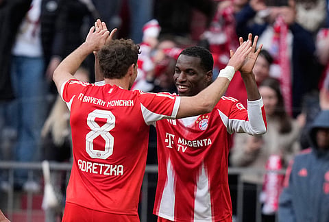 Bayern's Leon Goretzka and Nicolas Jackson celebrate after scoring during a Bundesliga soccer match between Bayern and Stuttgart in Munich, Germany.