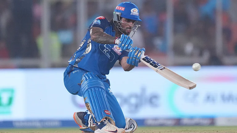 Mumbai Indians' Tilak Verma hits a six during the Indian Premier League cricket match between Gujarat Titans and Mumbai Indians in Ahmedabad, - Ajit Solanki