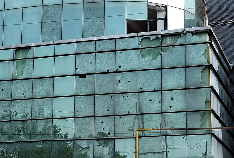 noida workers protest Broken facade of a factory