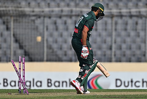 Bangladesh's Md. Saif Hassan leaves the ground after losing his wicket by New Zealand's Nathan Smith during the second one day international cricket match between Bangladesh and New Zealand in Mirpur, Bangladesh.