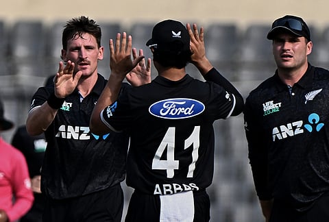 New Zealand's Nathan Smith, left celebrates the wicket of Bangladesh's Md. Saif Hassan during the second one day international cricket match between Bangladesh and New Zealand in Mirpur, Bangladesh.