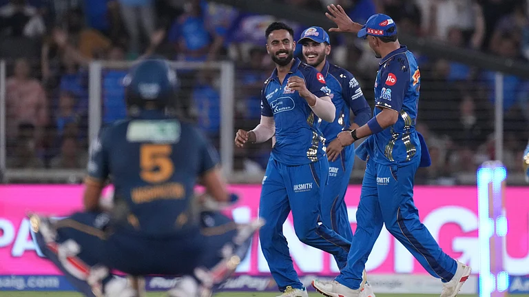 Naman Dhir celebrating after taking the catch of Washington Sundar during GT vs MI IPL 2026 match at Narendra Modi Stadium in Ahmedabad. - AP Photo